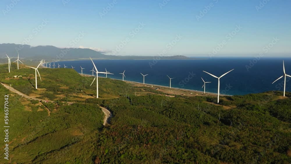 Aerial view of Wind turbines for electric power production on the seashore. Wind power plant. Ecological landscape. Philippines. Aerial view of Wind turbines for electric power production on the seashore. Wind power plant. Ecological landscape. Philippines.