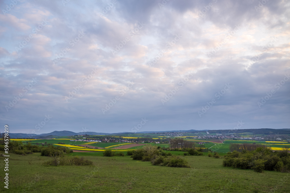 rural landscape with clouds and sky on a spring evening