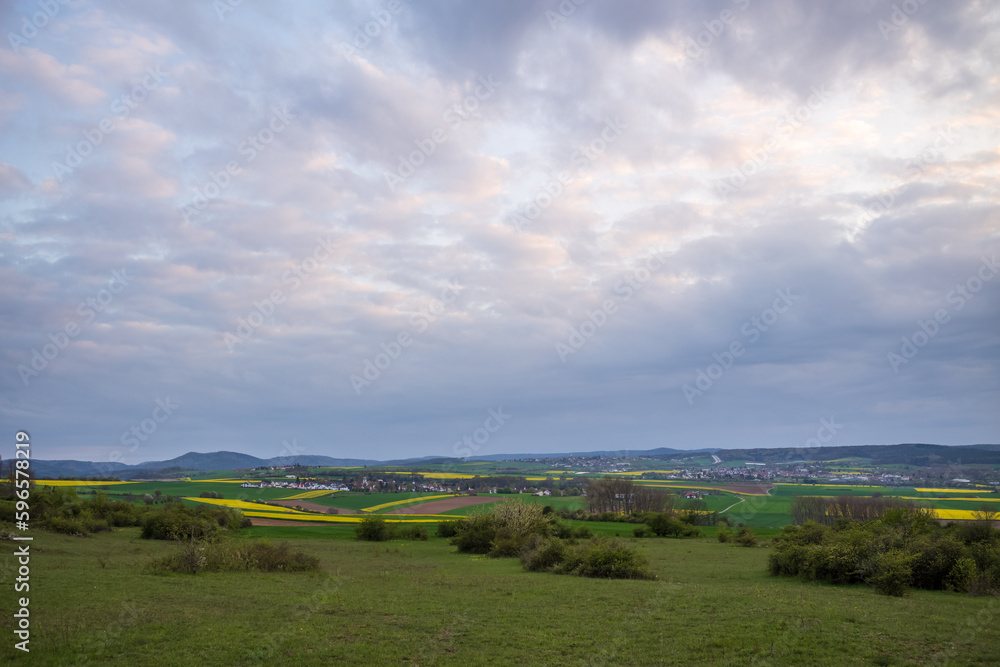 rural landscape with clouds and sky on a spring evening rural landscape with clouds and sky on a spring evening