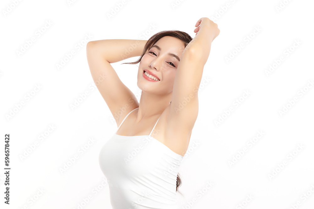 Obraz premium Beautiful Young Asian woman lifting hands up to show off clean and hygienic armpits or underarms on white background, Smooth armpit cleanliness and protection concept