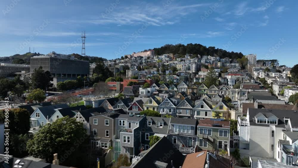 Forwards fly over rows of colourful residential houses on slope rising above city. Forwards fly over rows of colourful residential houses on slope rising above city.