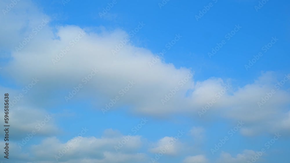 Fluffy clouds moving in the blue sky time-lapse captures the beauty and serenity of nature. The clouds appear to be dancing and changing shape in a tranquil blue sky, creating a mesmerizing effect.
Fluffy clouds moving in the blue sky time-lapse captures the beauty and serenity of nature. The clouds appear to be dancing and changing shape in a tranquil blue sky, creating a mesmerizing effect.