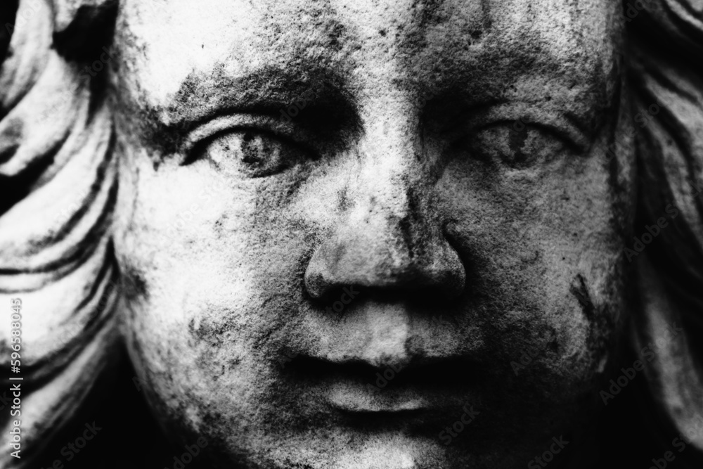 Obraz premium Macro image of angel as symbol of pain, fear and end of life. Fragment of an ancient statue.