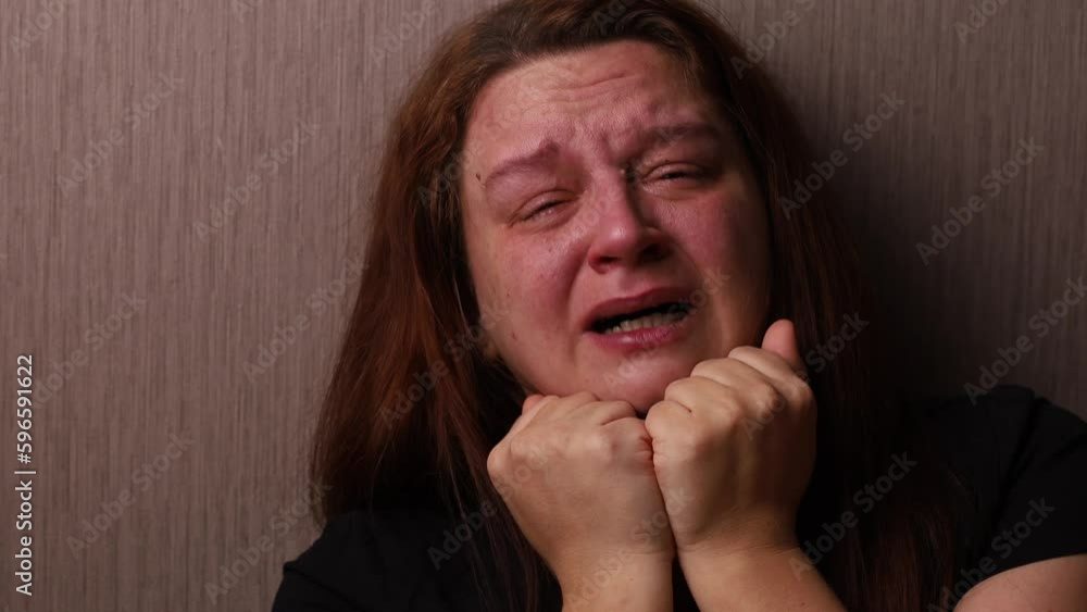 Exhausted woman hysterically cry wiping swollen face from tears with