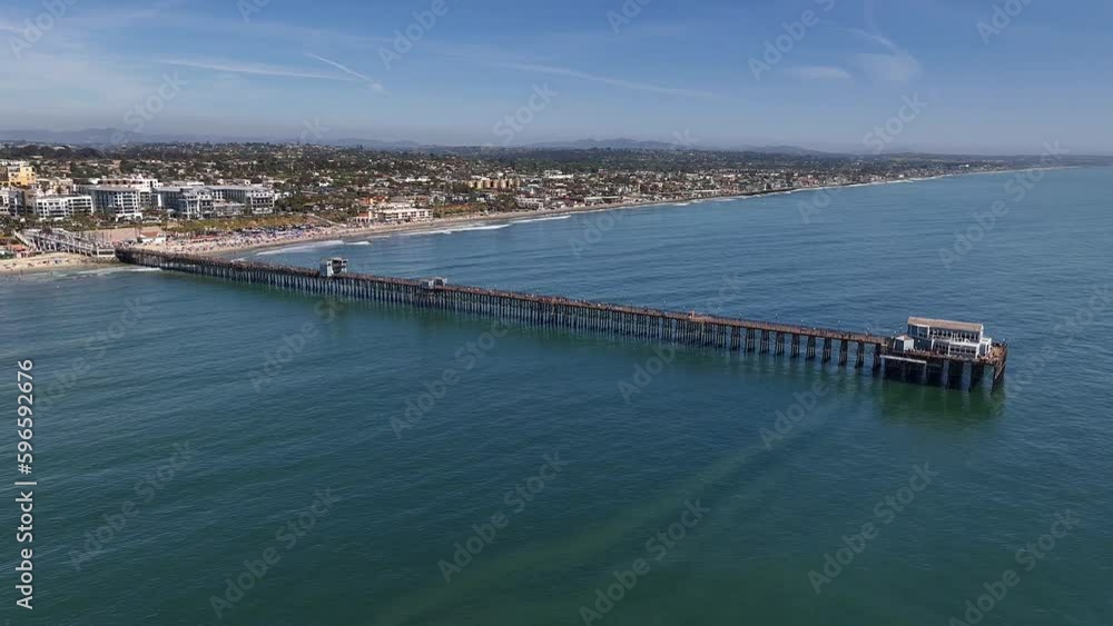Panning left aerial view of the Oceanside Ca Pier. Panning left aerial view of the Oceanside Ca Pier.