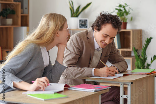 Teenage couple having lesso...