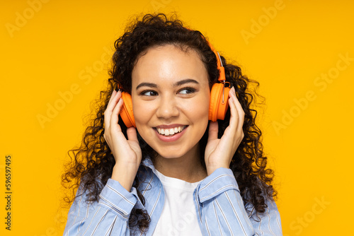 Young woman in casual wearing on yellow background