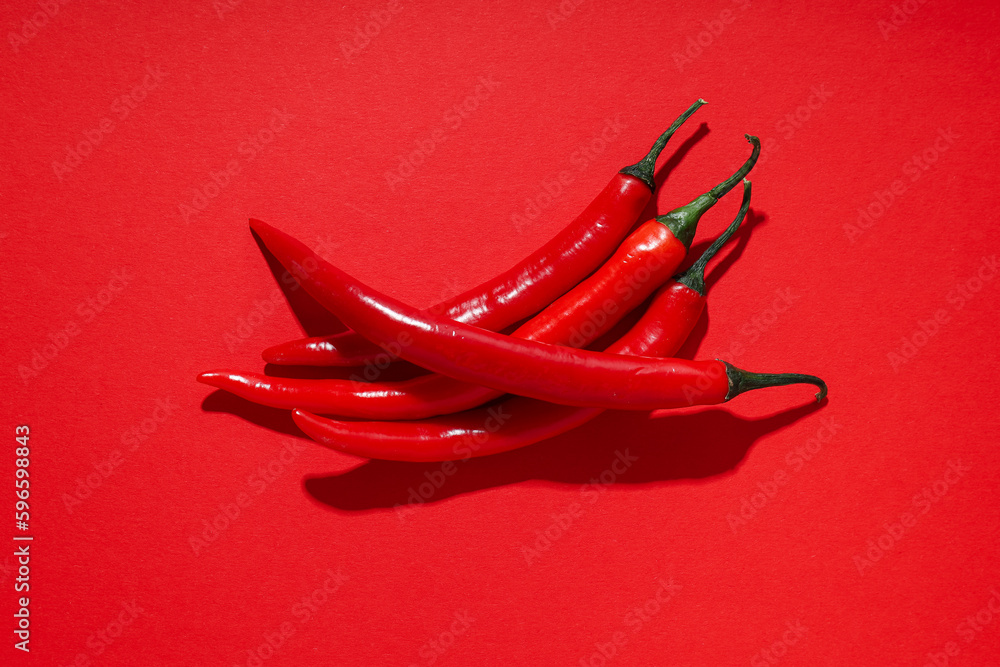 Concept of hot and spicy ingredients - red hot chili pepper Concept of hot and spicy ingredients - red hot chili pepper