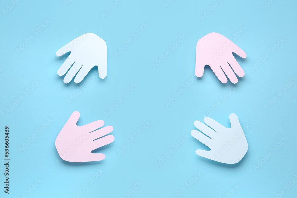 Frame made of paper palms on blue background. Friendship Day celebration Frame made of paper palms on blue background. Friendship Day celebration