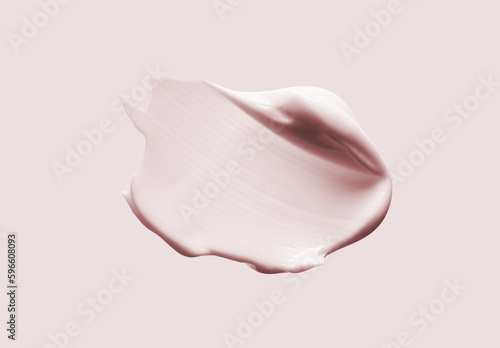 Cream balm cosmetic texture smudge on pastel pink background