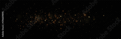 Golden glitter.Light effect.Glittering particles background. Gold dust on a transparent background.