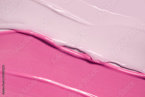 Cream balm cosmetic texture smudge or lip gloss on pastel pink background