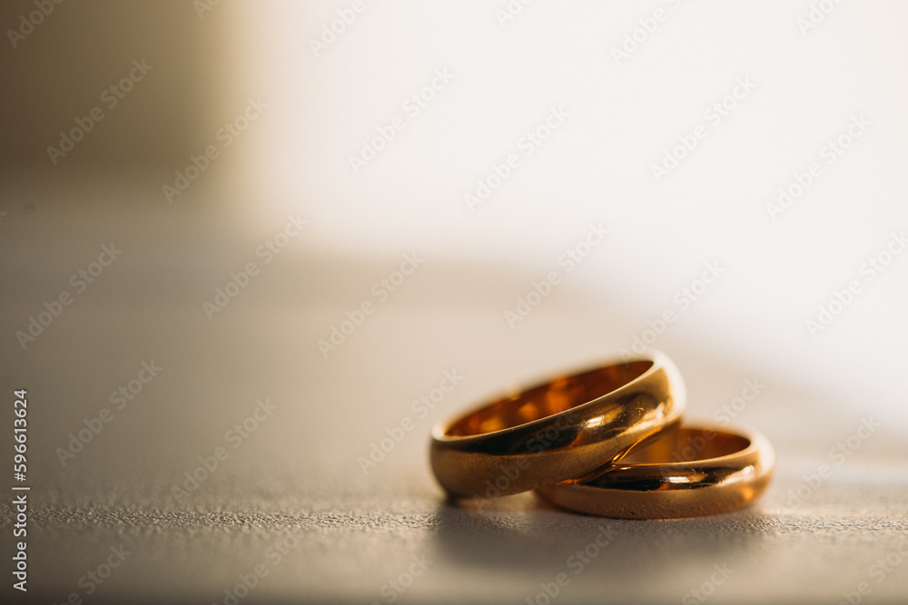 Wedding day. Golden rings table. Shadow. Wedding day. Ring. Photo. Shadow. 