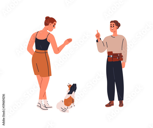 Canine trainer teaching dog owner to give command, gesturing to puppy. Profes...