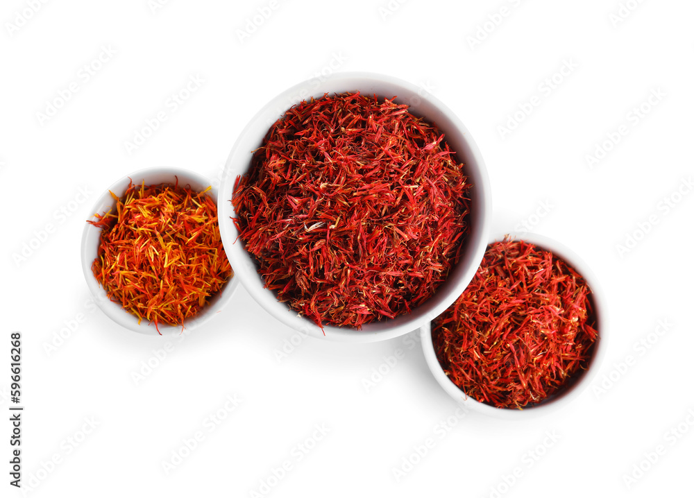 Bowls with pile of saffron on white background Bowls with pile of saffron on white background