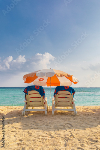 Beach umbrella and sunbeds ...