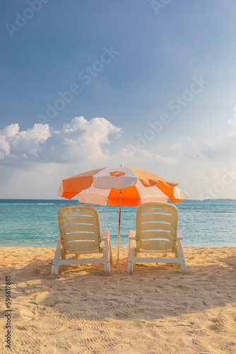 Beach umbrella and sunbeds ...