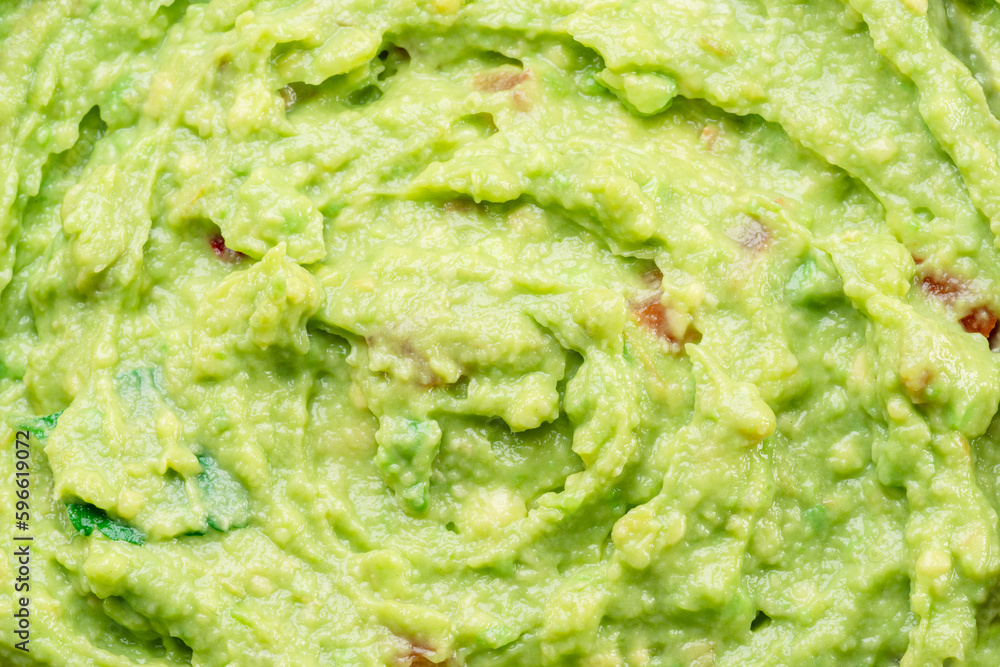 Guacamole sauce texture closeup. Guacamole sauce texture closeup.