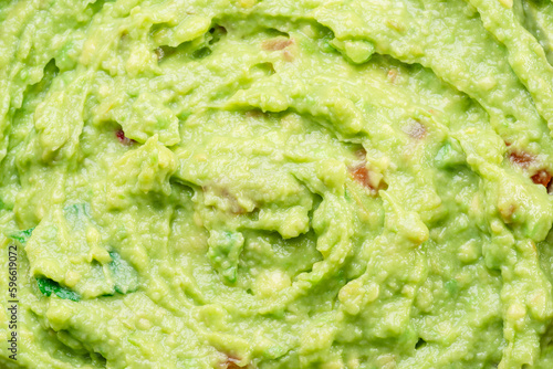 Photos Guacamole sauce texture closeup.