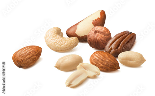 Scattered pecan, hazelnut, almond, peanut and brazil nuts isolated on white background.