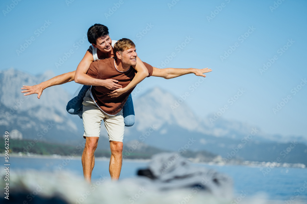 Couple in love opened their arms like the wings of an airplane. Trave concerts. High quality photo Couple in love opened their arms like the wings of an airplane. Trave concerts. High quality photo