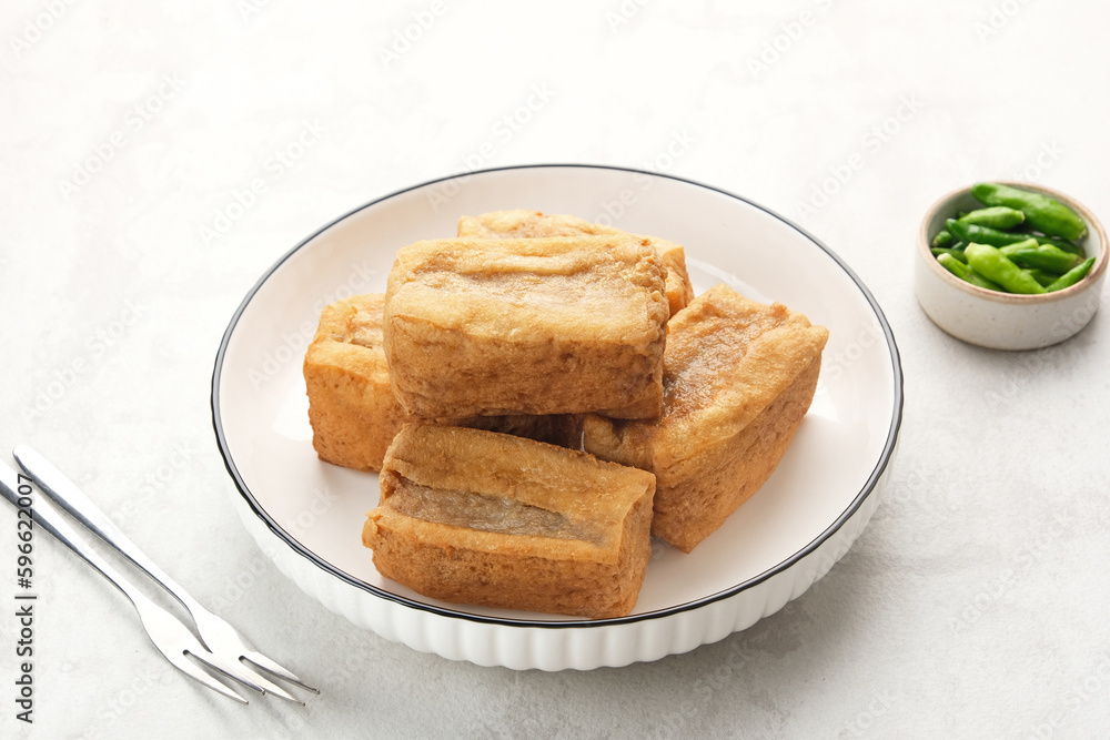 Tahu Bakso, made from tofu filled with meatball dough, served with chili. Indonesian traditional food
Tahu Bakso, made from tofu filled with meatball dough, served with chili. Indonesian traditional food