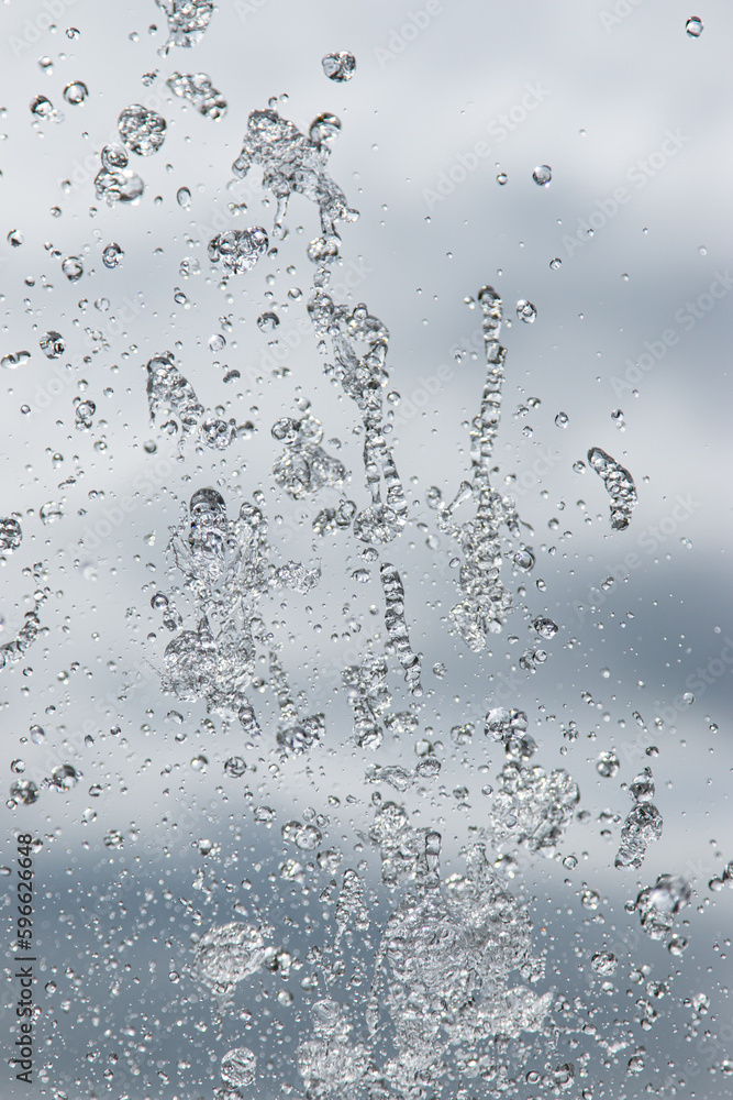splashes of water under pressure on a light background splashes of water under pressure on a light background