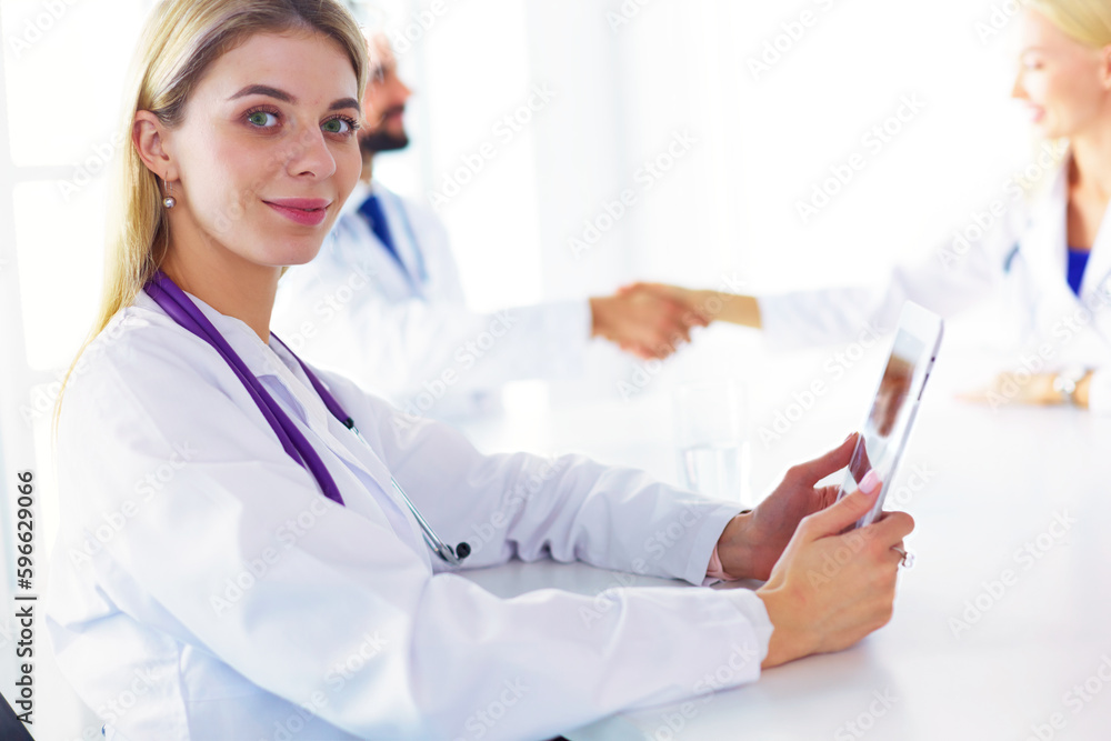 Team of doctors having consultation in clinic. Team of doctors having consultation in clinic.