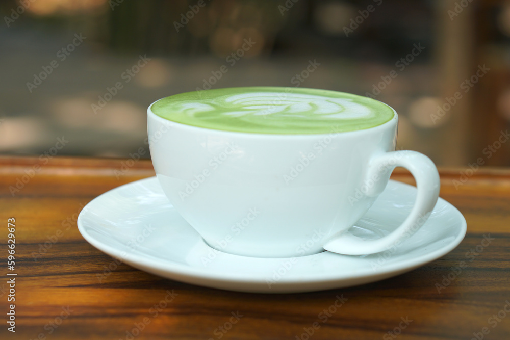 Hot green tea. Flower bubbles in a glass.