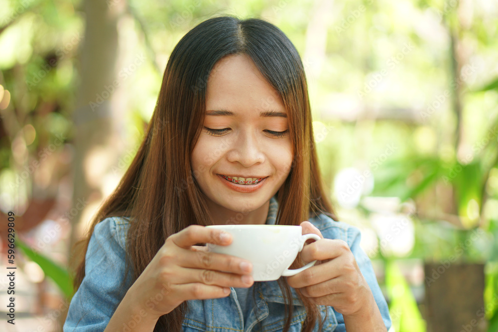 Woman drinking coffee in the morning before work Woman drinking coffee in the morning before work