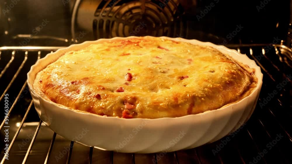 Quiche pie baking in oven. Open pie with cheese. French tart baking. Timelapse. Homemade bakery concept. Quiche lorraine. Close-up in 4K, UHD Quiche pie baking in oven. Open pie with cheese. French tart baking. Timelapse. Homemade bakery concept. Quiche lorraine. Close-up in 4K, UHD