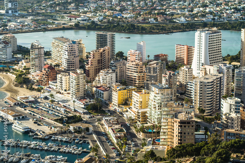 modern apartments  Cantal Roig beach and sailboats and fishing boats in the port of Calpe. Top view  horizontal