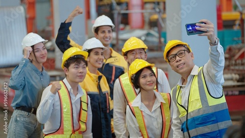 Groups diversity factory workers standing and take a selfie happy and cheerful at industrial manufacturing factory