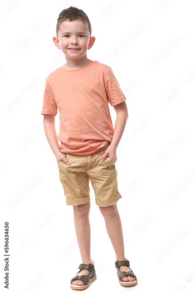 Attractive young boy in pastel t-shirt and shorts on isolated white background. Attractive young boy in pastel t-shirt and shorts on isolated white background.