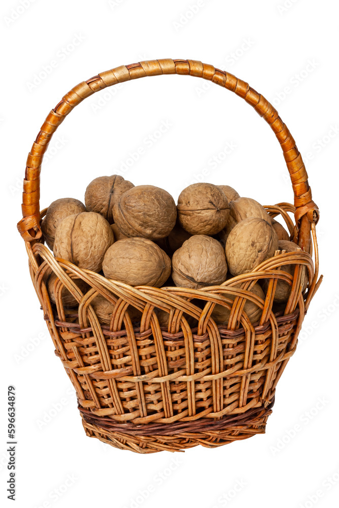Walnuts in a wicker basket isolated on white background. Walnuts in a wicker basket isolated on white background.