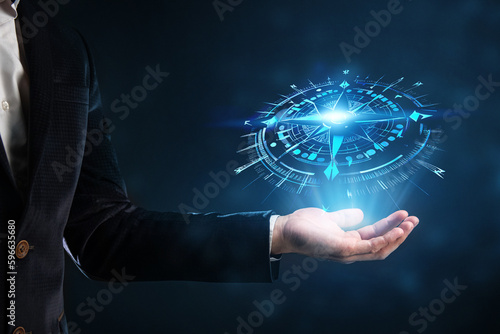 Fototapeta Naklejka Na Ścianę i Meble -  Concept of Strategic orientation in business or marketing. Purpose and direction in business. Compass in the hands of a businessman
