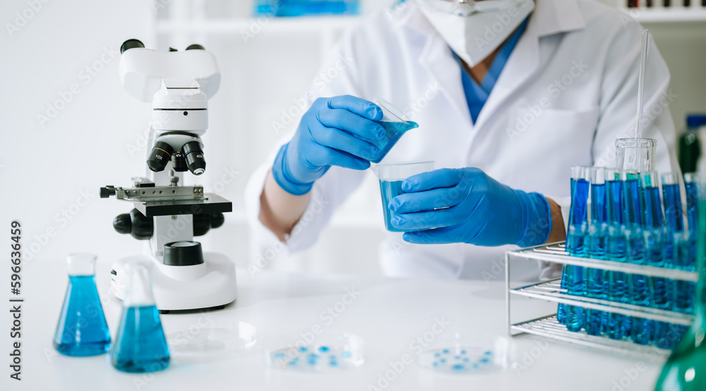 Male biotechnologist testing new chemical substances in a laboratory. Male biotechnologist testing new chemical substances in a laboratory.