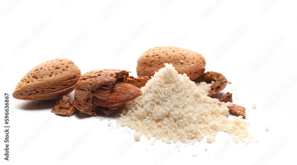 Almonds ground pile, kernel and whole shell isolated on white Almonds ground pile, kernel and whole shell isolated on white