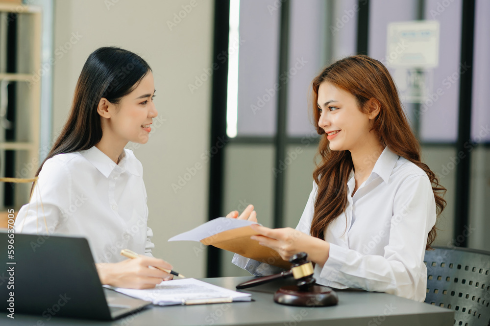 Business and Female lawyer or judge consult having team meeting with client, Law and Legal services concept.Customer service good cooperation in office. Business and Female lawyer or judge consult having team meeting with client, Law and Legal services concept.Customer service good cooperation in office.