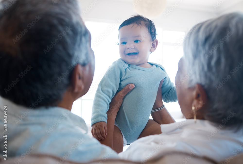 Obraz premium Babys have the gift of making everyone silly. Shot of grandparents bonding with their grandchild on a sofa at home.