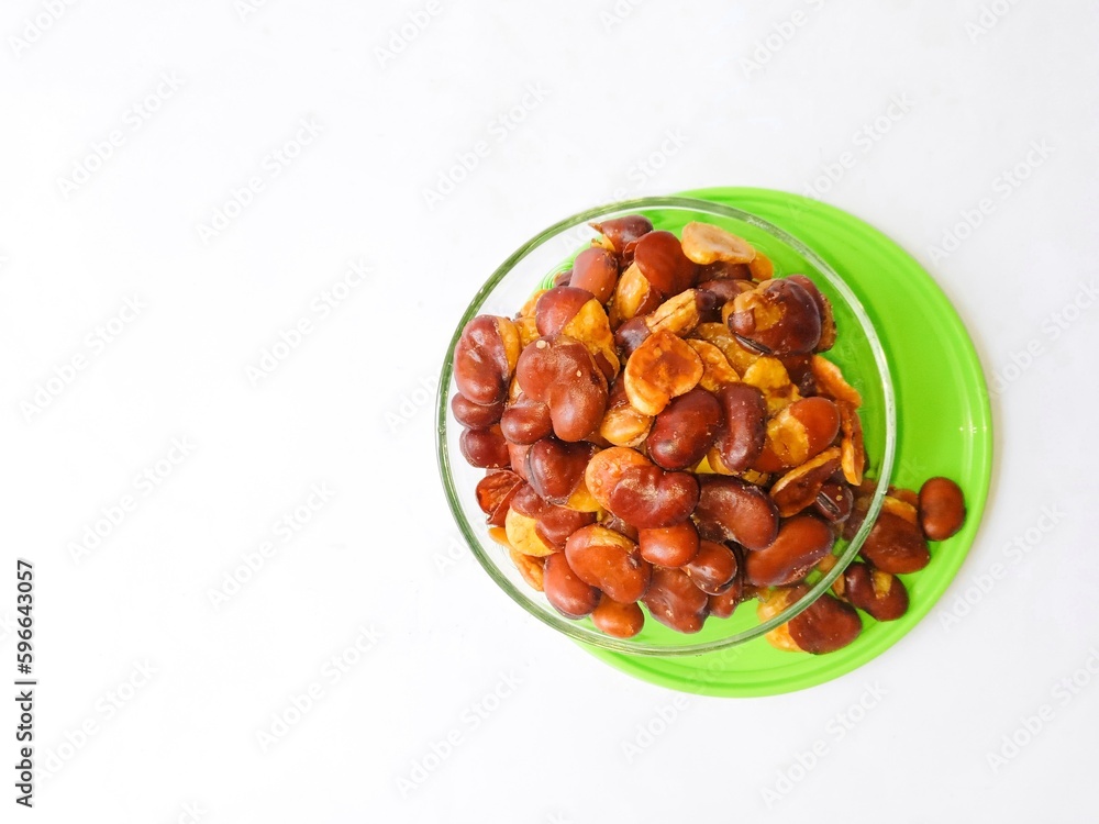 Koro beans or parang beans (Canavalia ensiformis) a traditional snack from Indonesia. Delicious and salty snack. bowl of nuts Koro beans or parang beans (Canavalia ensiformis) a traditional snack from Indonesia. Delicious and salty snack. bowl of nuts