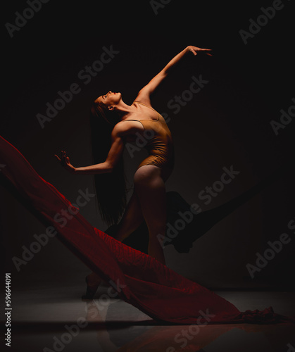 Fototapeta Naklejka Na Ścianę i Meble -  Passion only grows. Shot of a performer dancing against a dark background.