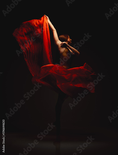 Fototapeta Naklejka Na Ścianę i Meble -  The stars can wait.... Shot of a performer dancing against a dark background.