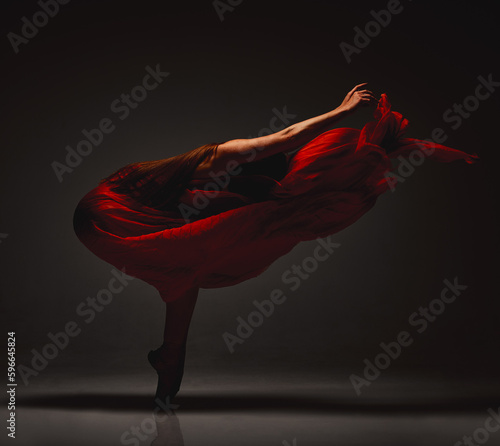 Fototapeta Naklejka Na Ścianę i Meble -  A source of wow. Shot of a performer dancing against a dark background.