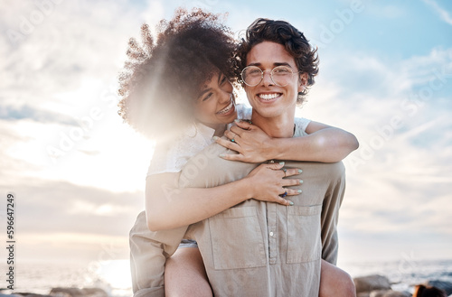 Fotografía Portrait of a young mixed race couple enjoying a day at the beach looking happy and in love