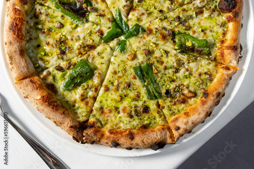 Pizza with jalapeno and pistachios