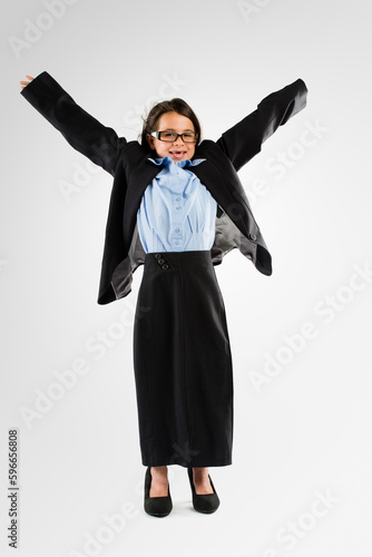 Im the boss of me. Studio shot of an adorable little girl dressing up as a businesswoman.