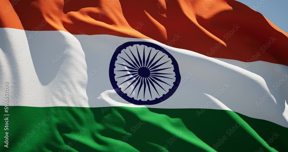Close-up of the national flag of India flutters in the wind on a sunny day , 4k slow motion
