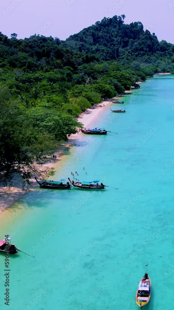 Koh Kradan Island Southern Thailand with longtail boats at the beach
