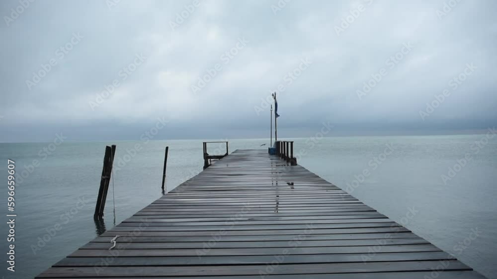 Pier and Harbour in Caye Caulker Island in Belize, Caribbean Sea. Cloudy Sky. Windy Pier and Harbour in Caye Caulker Island in Belize, Caribbean Sea. Cloudy Sky. Windy